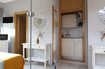 a bedroom with a bed with blue sheets and two lamps at Agua Viva by Umbral in Albufeira