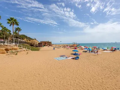 a sign on a beach with the ocean in the background at Apartment Happy Moments by Interhome in Albufeira