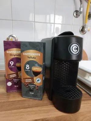 a coffee maker sitting next to a box of coffee at Apartamento Batalha - Quarteira, Algarve, Portugal in Quarteira