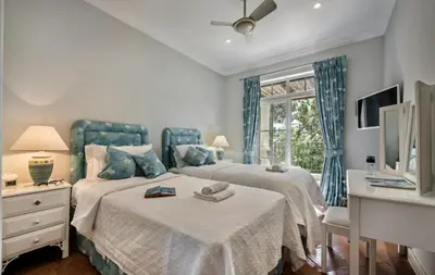 a bedroom with two beds and a window at Quinta do Lago 2-Bed Apartment - Golf Pool & Ac in Faro