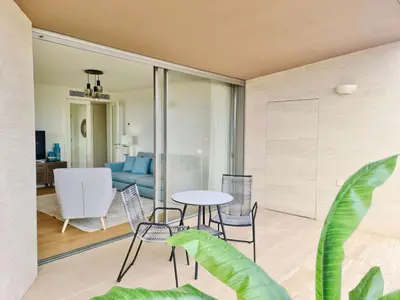 a living room with a table and chairs at La Vila Nature, Laguna Village 246-Clever Details, Luxury apartment, located in a quiet area, BBQ and free Wi-Fi in Vilamoura