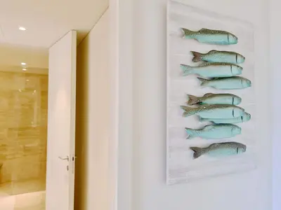 a painting of fish on a wall in a room at La Vila Nature, Laguna Village 246-Clever Details, Luxury apartment, located in a quiet area, BBQ and free Wi-Fi in Vilamoura