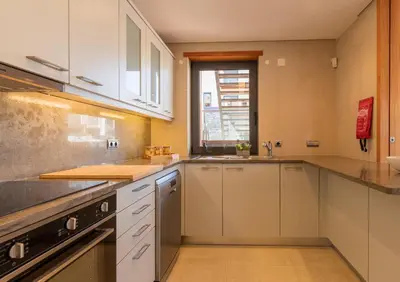a large kitchen with white cabinets and a window at Algarve: Vale Lobo Golf&Beach with Private Pool II in Almancil