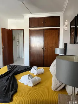 a hotel room with towels on a bed at Casa da Praia - Santa Eulália Beach in Albufeira
