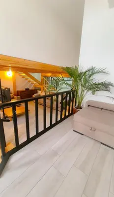 a living room with a balcony with a couch at Mezzanine 4 Faro in Faro