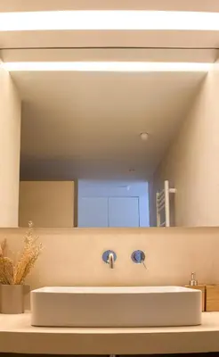 a bathroom with a sink and a mirror at YES! Incrível Vista Piscina T2 HsR Vilamarina in Vilamoura