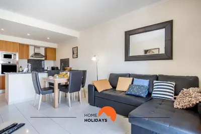 a living room with a couch and a table at #107 T1 Vista das Ondas by Home Holidays in Albufeira