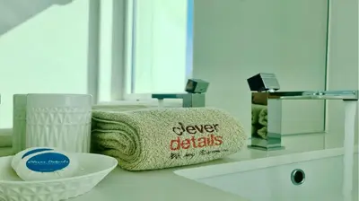 a bathroom with a towel and a bowl on a counter at Villa Miya - Clever Details, walking distance from the Marina, restaurants, bakeries and supermarkets,, free wifi, pool in Vilamoura