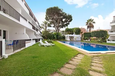 an image of the backyard of a building with a swimming pool at Mouramar Vilamoura in Vilamoura