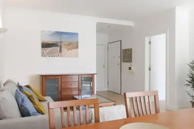 a living room with a couch and a table at Cosy flat, Salgados Village in Guia