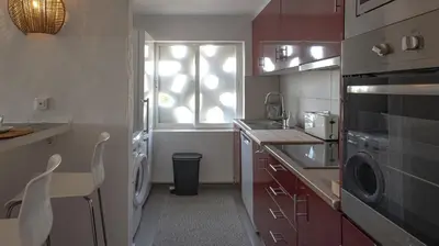 a small kitchen with a sink and a window at Loft Quinta da Balaia - Jacuzzi - By BEDZY in Albufeira