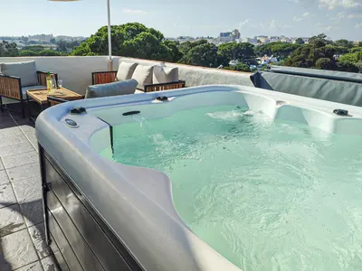 a hot tub sitting on top of a roof at Loft Quinta da Balaia - Jacuzzi - By BEDZY in Albufeira