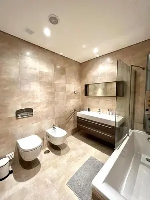 a bathroom with a toilet and a tub and a sink at Funtastic Villa With Pool in Albufeira