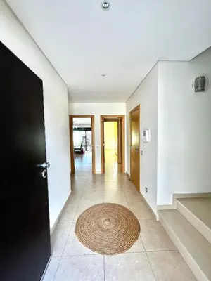 a hallway with a black door and a rug on the floor at Funtastic Villa With Pool in Albufeira