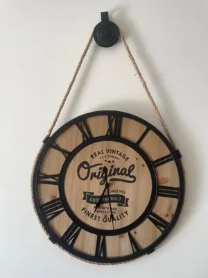 a clock hanging on a wall with the word original at Kasa Joly Albufeira By Calyferias in Albufeira