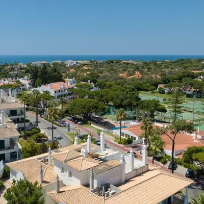 an aerial view of a city with buildings and the ocean at Apartment Kairi in Vale do Lobo