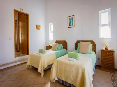 a bedroom with two beds and a mirror at Luxury Algarve Villa 3 Bedrooms Casa Martins Private Pool Rural Setting Loule in Loulé
