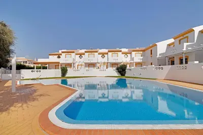 a large swimming pool in front of a building at Villa Acoteias - By Dalma Portuguesa in Olhos de Água