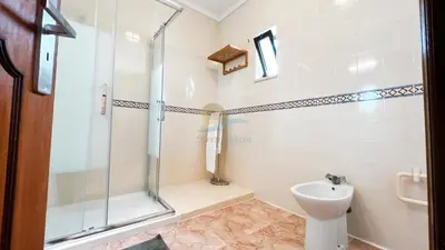 a bathroom with a shower and a toilet and a sink at Albufeira Calipto by Sunny Deluxe in Albufeira