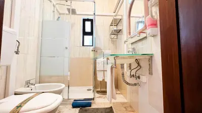 a small bathroom with a sink and a toilet at Albufeira Calipto by Sunny Deluxe in Albufeira