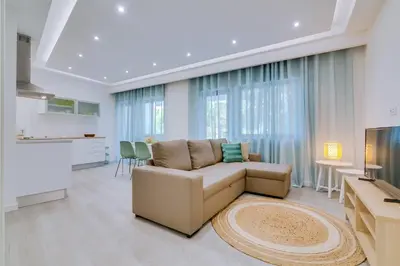 a living room with a couch and a table at Marina Star Guesthouse in Faro