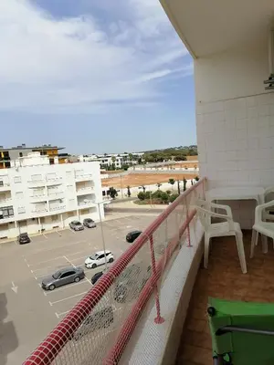 a balcony with a view of a parking lot at Leonel Barcelos in Quarteira
