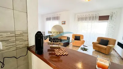a kitchen and living room with a chess board on a counter at Apartamentos Oura AreiaSol by Sunny Deluxe in Albufeira