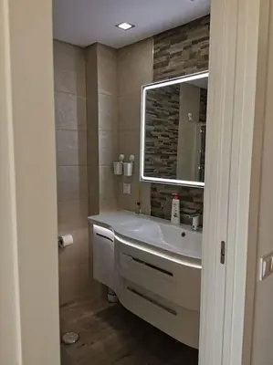 a bathroom with a sink and a mirror at Santa Fé in Albufeira