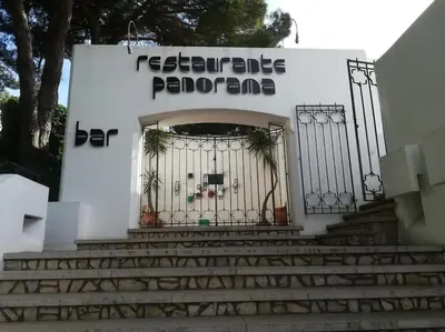 a gate on the side of a building with stairs at Santa Fé in Albufeira