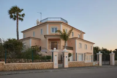 a living room with a couch and two chairs and a table at Villa Monte das Oliveiras with Private Pool in Albufeira