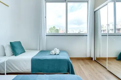 a bedroom with a bed with a teddy bear on it at Faro Center with AC & WiFi in Faro