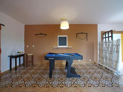 a room with a ping pong table in the middle of a room at Holiday Home Sebastião by Interhome in Paderne