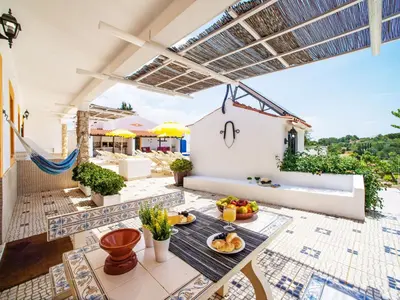 a patio with a table with fruit on it at Holiday Home Eugênia by Interhome in Paderne