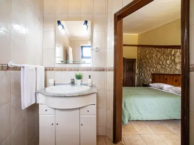two beds in a hotel room with towels on them at Holiday Home Ana by Interhome in Paderne
