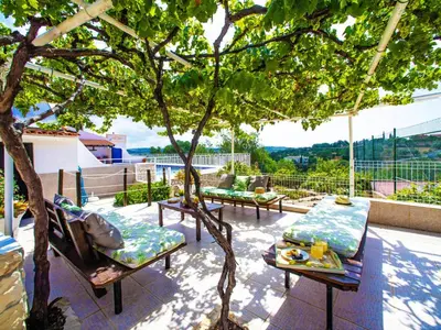 a gate to a house with a stone wall at Holiday Home Ana by Interhome in Paderne