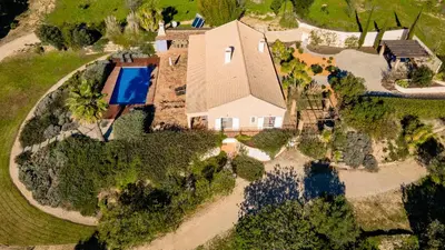 an aerial view of a house with a swimming pool at Casa de Apra by Portucasa in Loulé