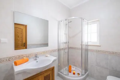 a bathroom with a sink and a shower at Villa Bahia by Algarve Vacation in Albufeira