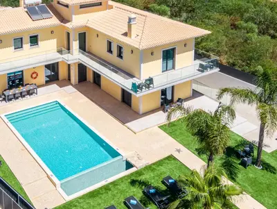 an aerial view of a house with a swimming pool at Villa Coral Bay by Algarve Vacation in Albufeira