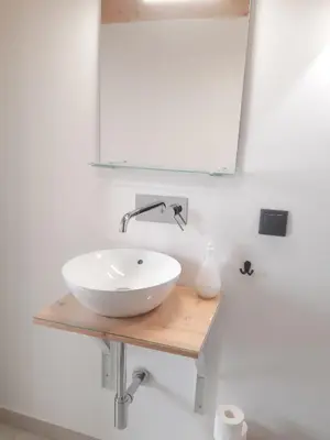 a bathroom with a white sink and a mirror at Casa aOrta Studios in Faro
