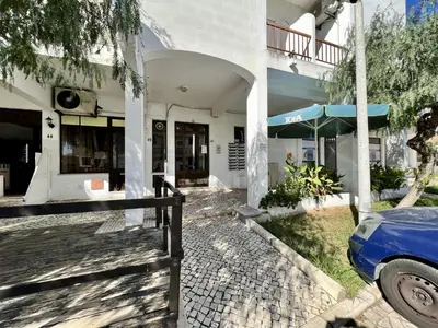 a blue car parked in front of a building at Albufeira Downtown With Pool by Homing in Albufeira
