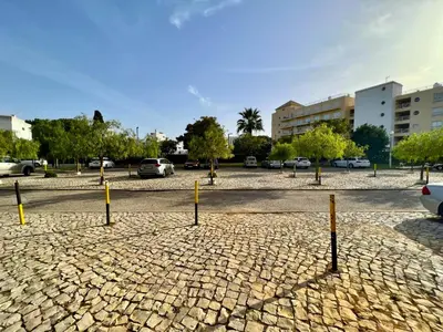 a group of yellow poles in a parking lot at Vilamoura Central 4 With Pool by Homing in Vilamoura