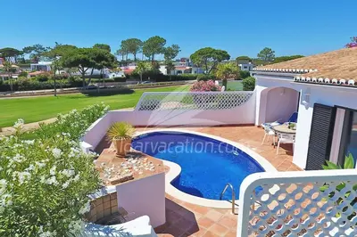 a villa with a swimming pool and a house at Villa Seaside in Vale do Lobo