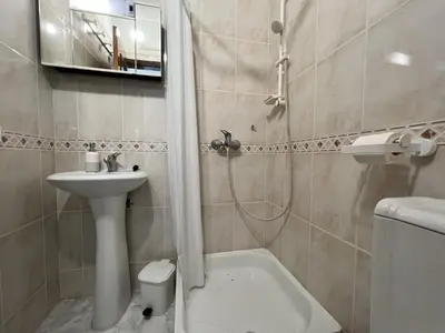 a bathroom with a sink and a toilet and a shower at Albufeira Falesia Beach 4 by Homing in Albufeira