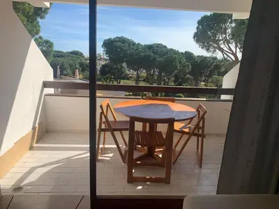 a table and chairs on a balcony with a view at Apartment 3 persons in Vilamoura, Algarve in Quarteira