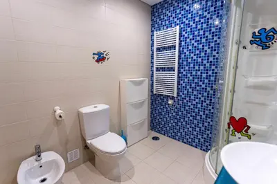 a bathroom with a toilet and a shower and a sink at Marina Vilamoura - Aquamar 006 By Vilamoura Sun in Vilamoura