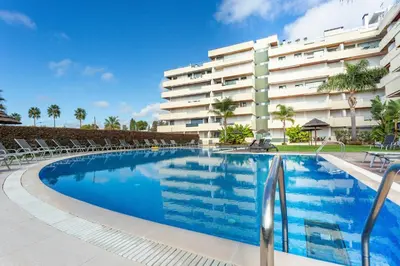 a swimming pool in front of a building at Marina Vilamoura - Aquamar 006 By Vilamoura Sun in Vilamoura