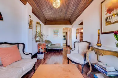 a living room with a couch and two chairs at À dos Reis in Faro