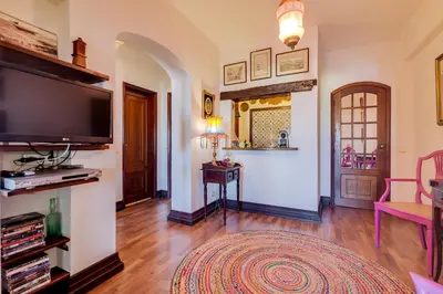 a living room with a large flat screen tv at À dos Reis in Faro