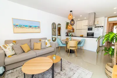 a living room with a couch and a table at By the sea, Algarve in Galé