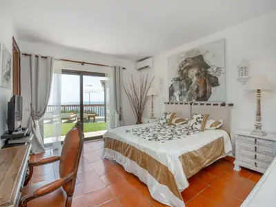 a bedroom with a bed and a large window at Beautiful Algarve Villa 5 Bedrooms Villa Pilar Amazing Beach & Sea Views in Albufeira